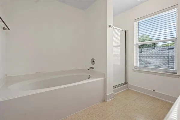 a white bath tub sitting next to a window