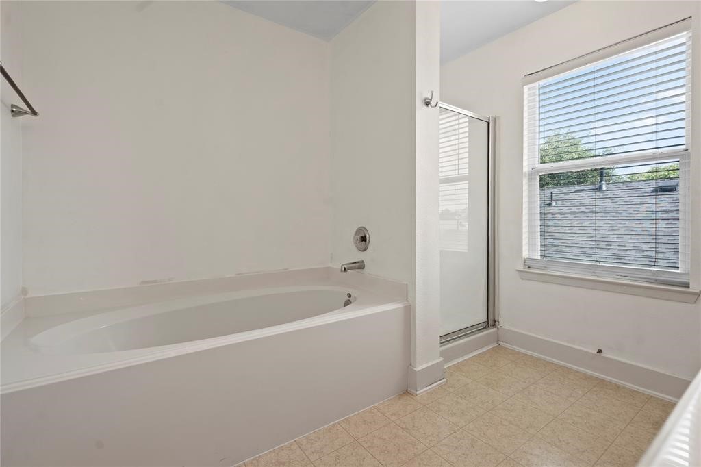 20729 Patriot Park Lane Katy, TX 77449 - Photo 23 of 39 a white bath tub sitting next to a window