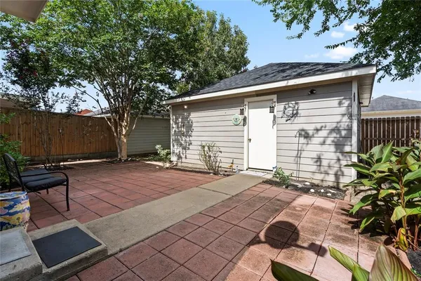 a backyard of a house with seating space