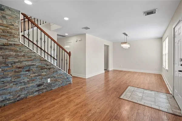 a view of entryway with wooden floor
