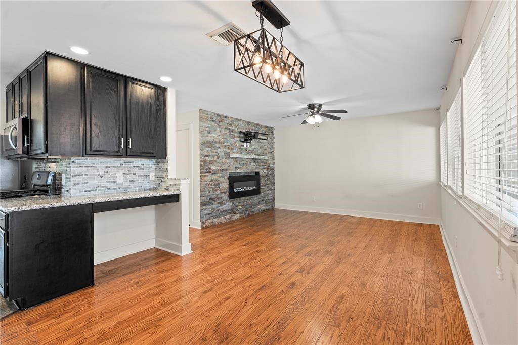 20729 Patriot Park Lane Katy, TX 77449 - Photo 10 of 39 a view of kitchen with granite countertop cabinets and wooden floor