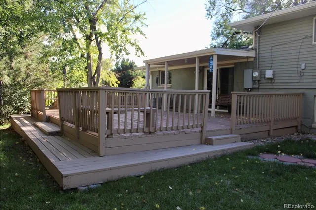 a view of a deck with a yard