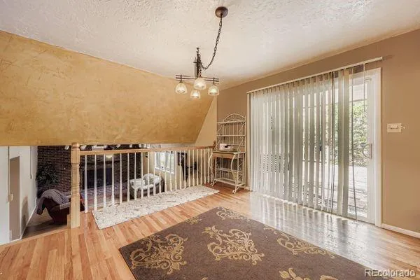 a view of a balcony with furniture