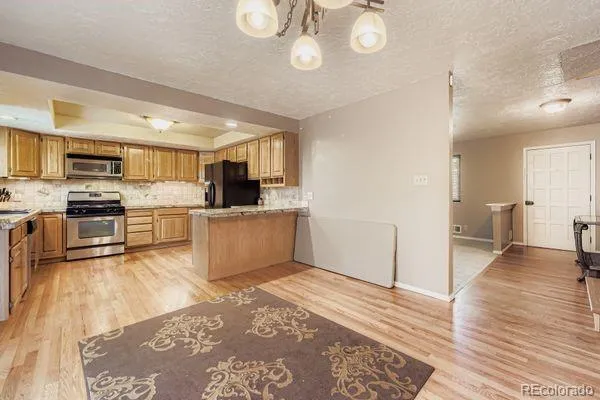 a view of kitchen with wooden floor