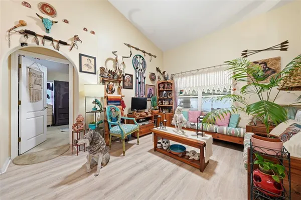 a living room with lots of furniture and a rug