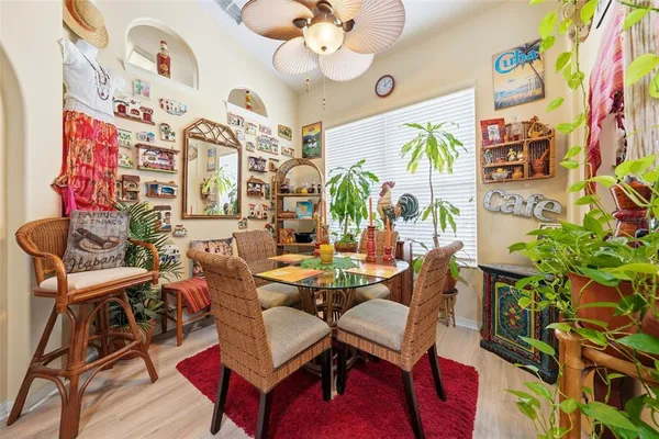 a living room with furniture a flat screen tv and a floor to ceiling window