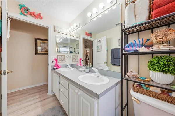 a living room with furniture fireplace and chandelier