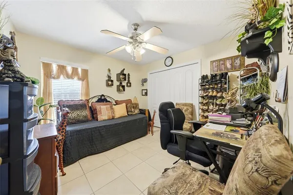 a bedroom with furniture a rug and a window