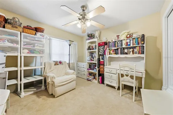a room with furniture a baby crib and a window