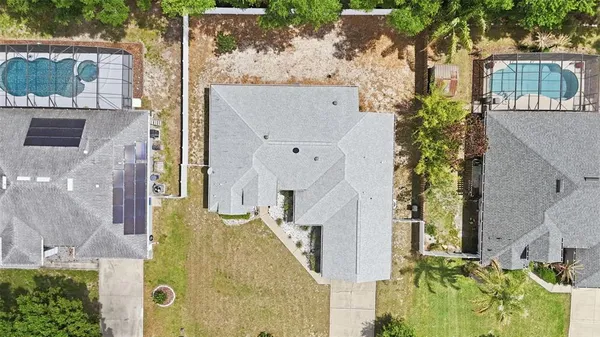 an aerial view of residential house with outdoor space and parking