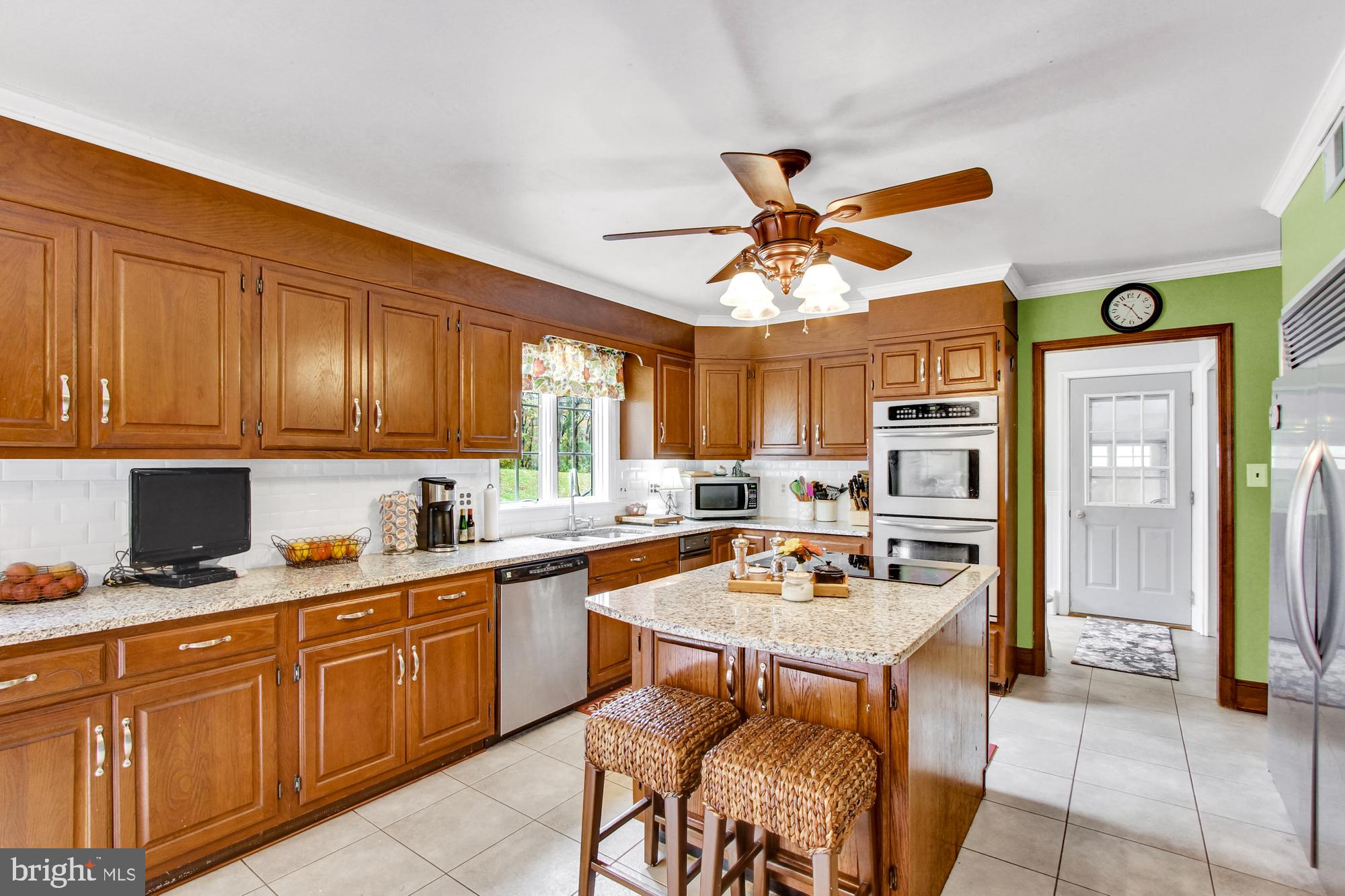 18902 Vernon Road White Hall, MD 21161 - Photo 47 of 69 A huge kitchen with lots of cabinets and a pantry.