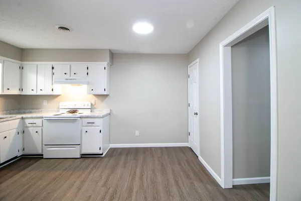 a view of kitchen with wooden floor