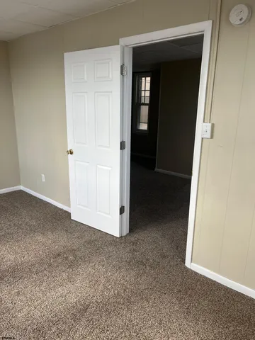 a kitchen with stainless steel appliances granite countertop white cabinets and a stove top oven