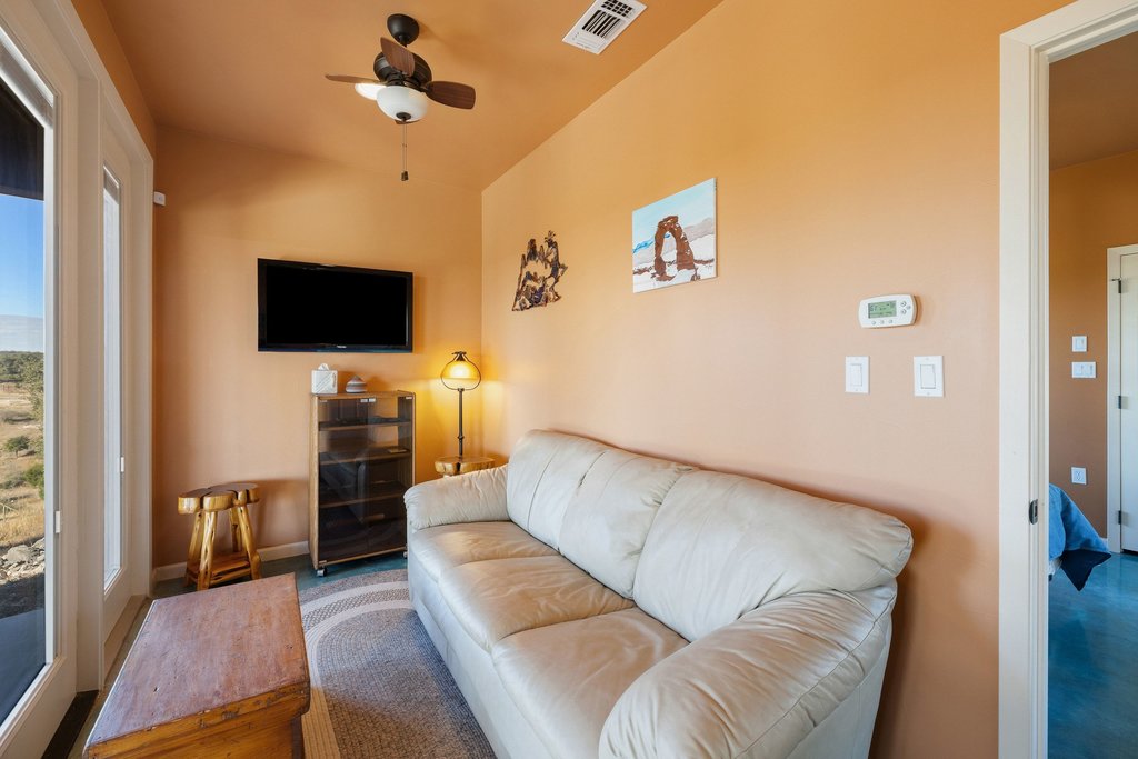 1292 Upper Turtle Creek Road Kerrville, TX 78028 - Photo 26 of 40 Living area featuring ceiling fan