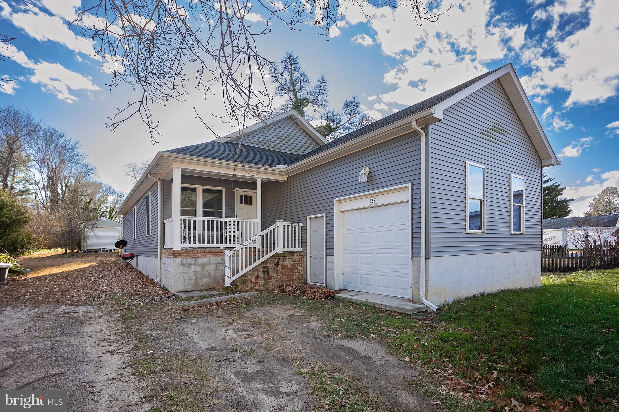 128 South Street Secretary, MD 21664 - Photo 1 of 14 a view of a house with a yard