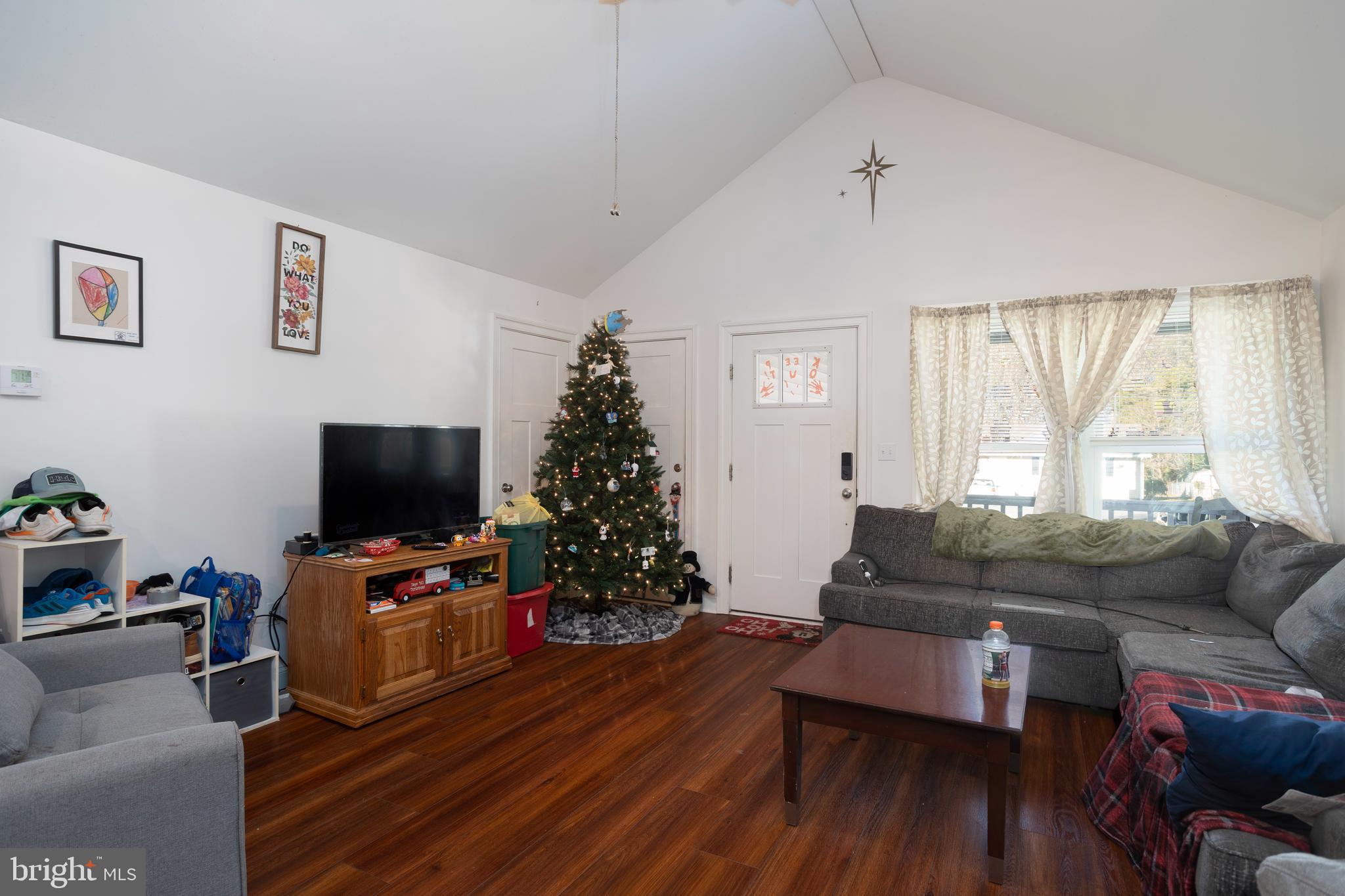 128 South Street Secretary, MD 21664 - Photo 3 of 14 a living room with furniture and a flat screen tv