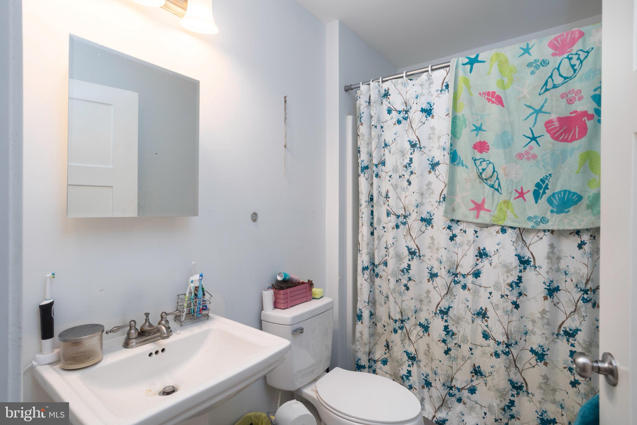 128 South Street Secretary, MD 21664 - Photo 9 of 14 a bathroom with a sink and a toilet
