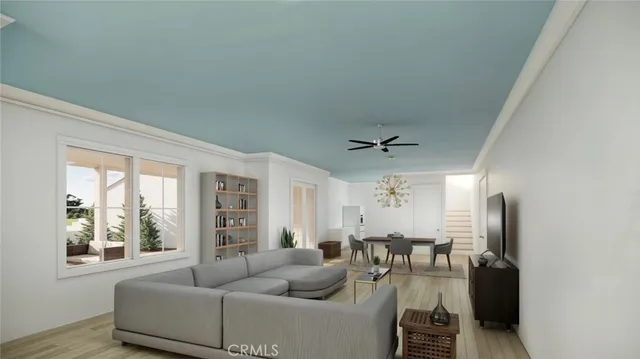 a living room with furniture and floor to ceiling windows