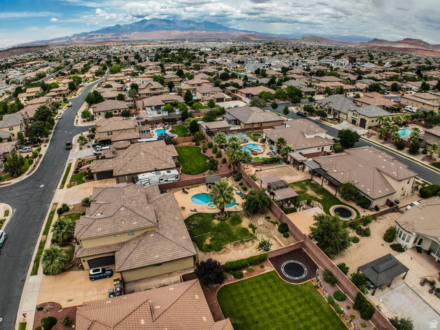 3683 South 2640 West St. George, UT 84790 - Photo 30 of 41 Residential neighborhood featuring a series of single-family homes with tile roofs, private swimming pools, and landscaped backyards