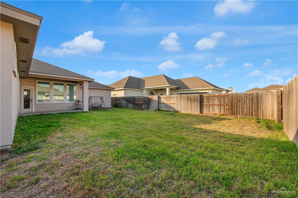 2514 Yarrow Street Mission, TX 78574 - Photo 17 of 22 Fenced backyard featuring a patio