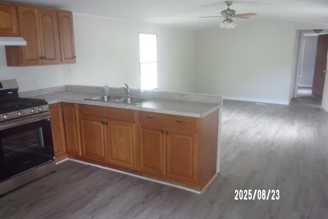 a kitchen with a sink and cabinets