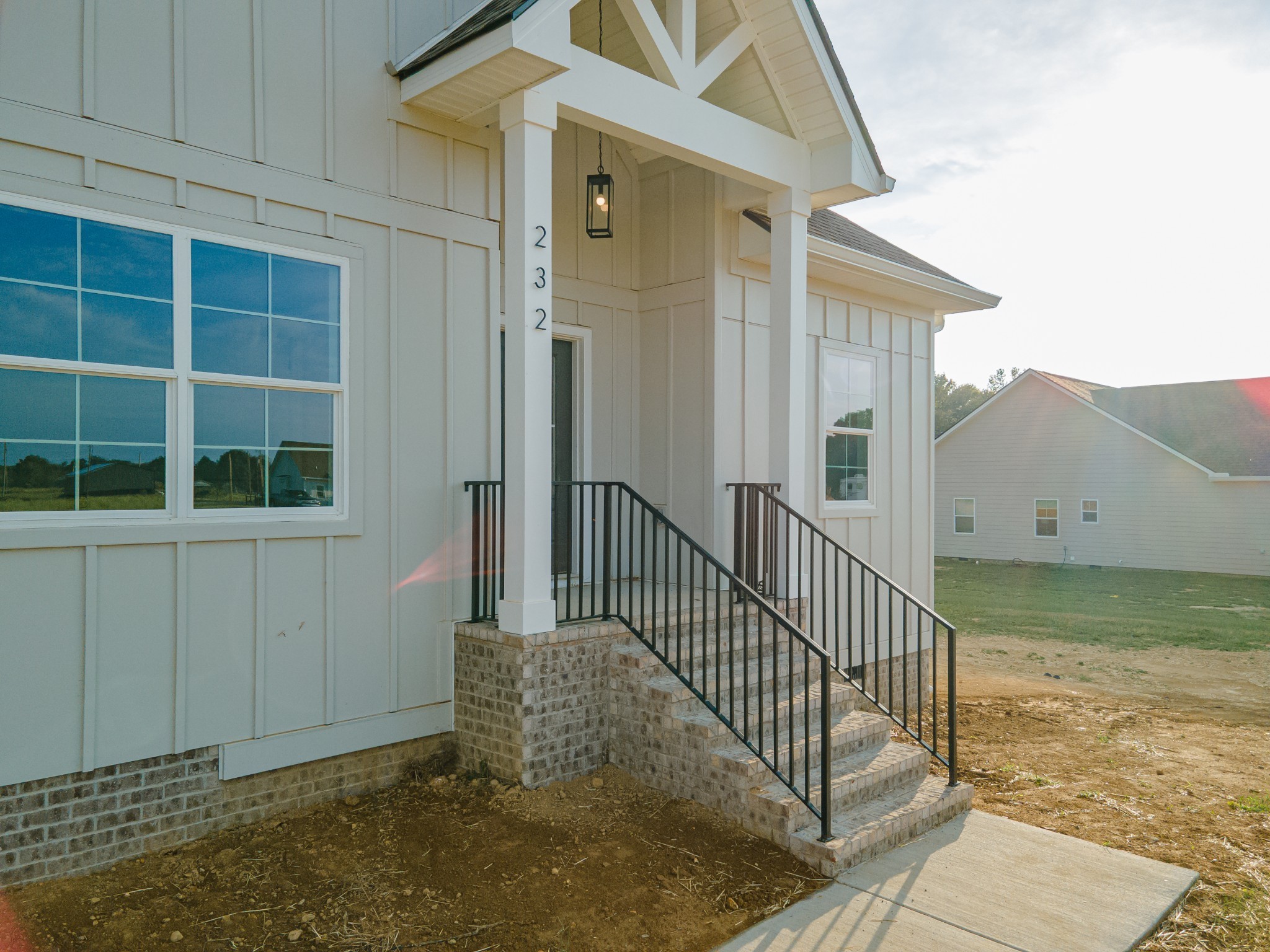 232 Dugout Road Summertown, TN 38483 - Photo 13 of 70 a view of a house with a small yard and wooden fence