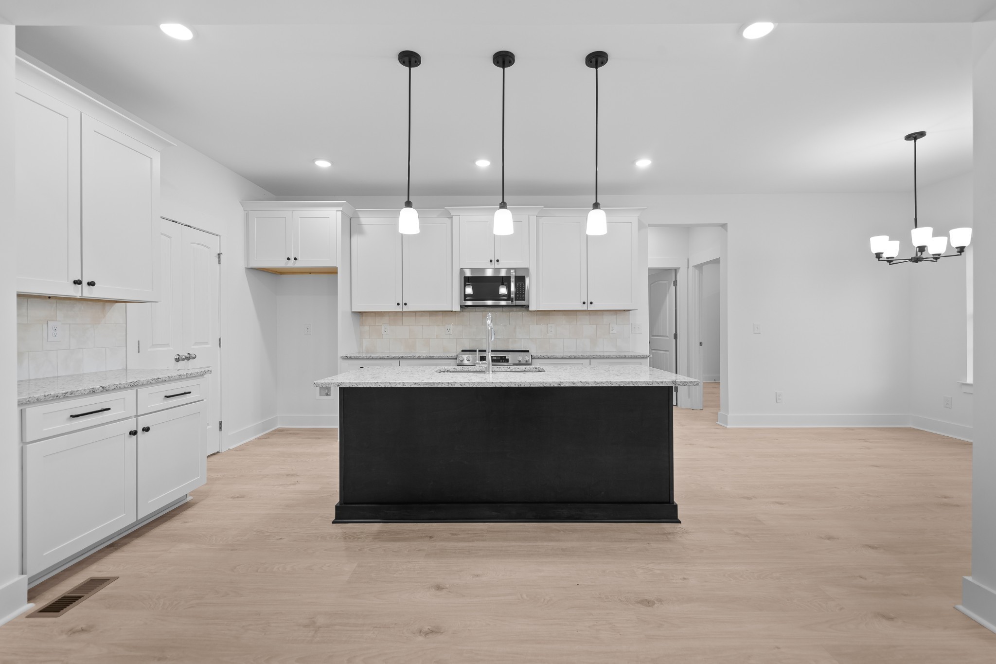 232 Dugout Road Summertown, TN 38483 - Photo 38 of 70 a large kitchen with cabinets a sink and a stove