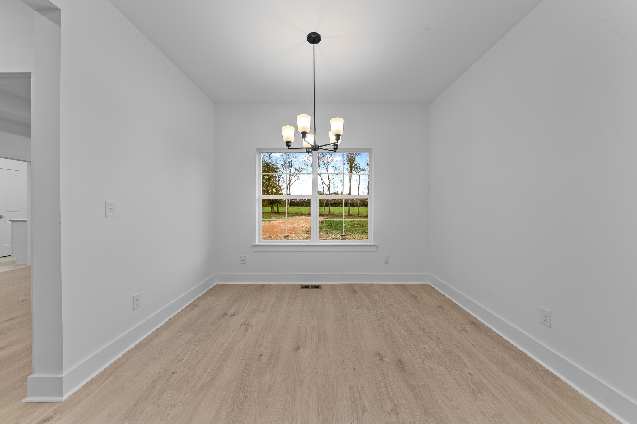 232 Dugout Road Summertown, TN 38483 - Photo 41 of 70 a view of wooden floor chandelier and window in a room