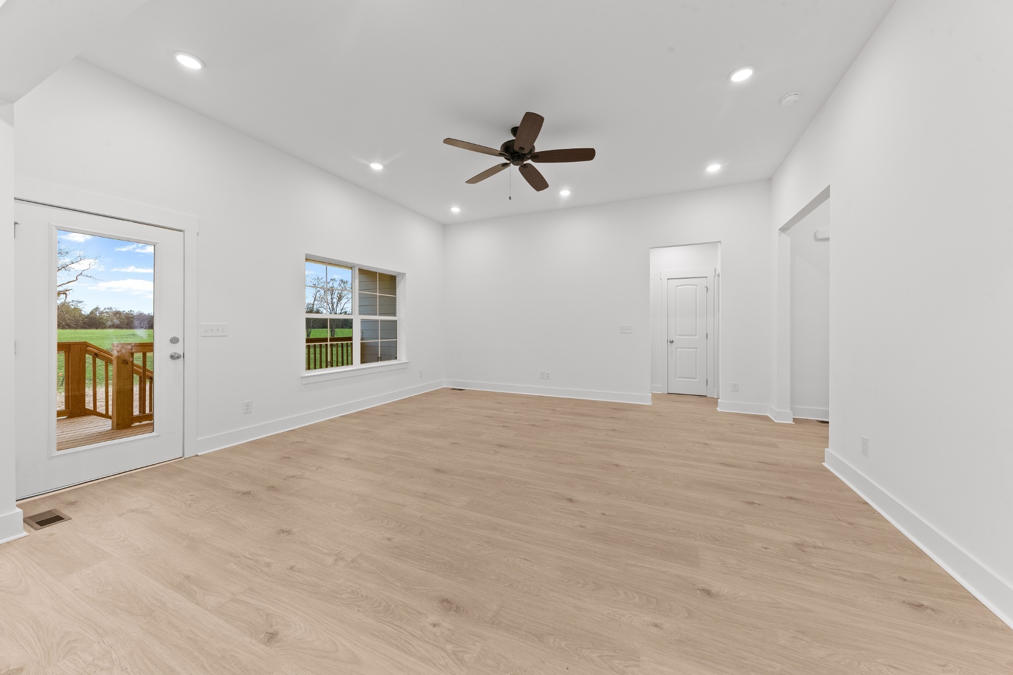 232 Dugout Road Summertown, TN 38483 - Photo 50 of 70 an empty room with chandelier fan and windows