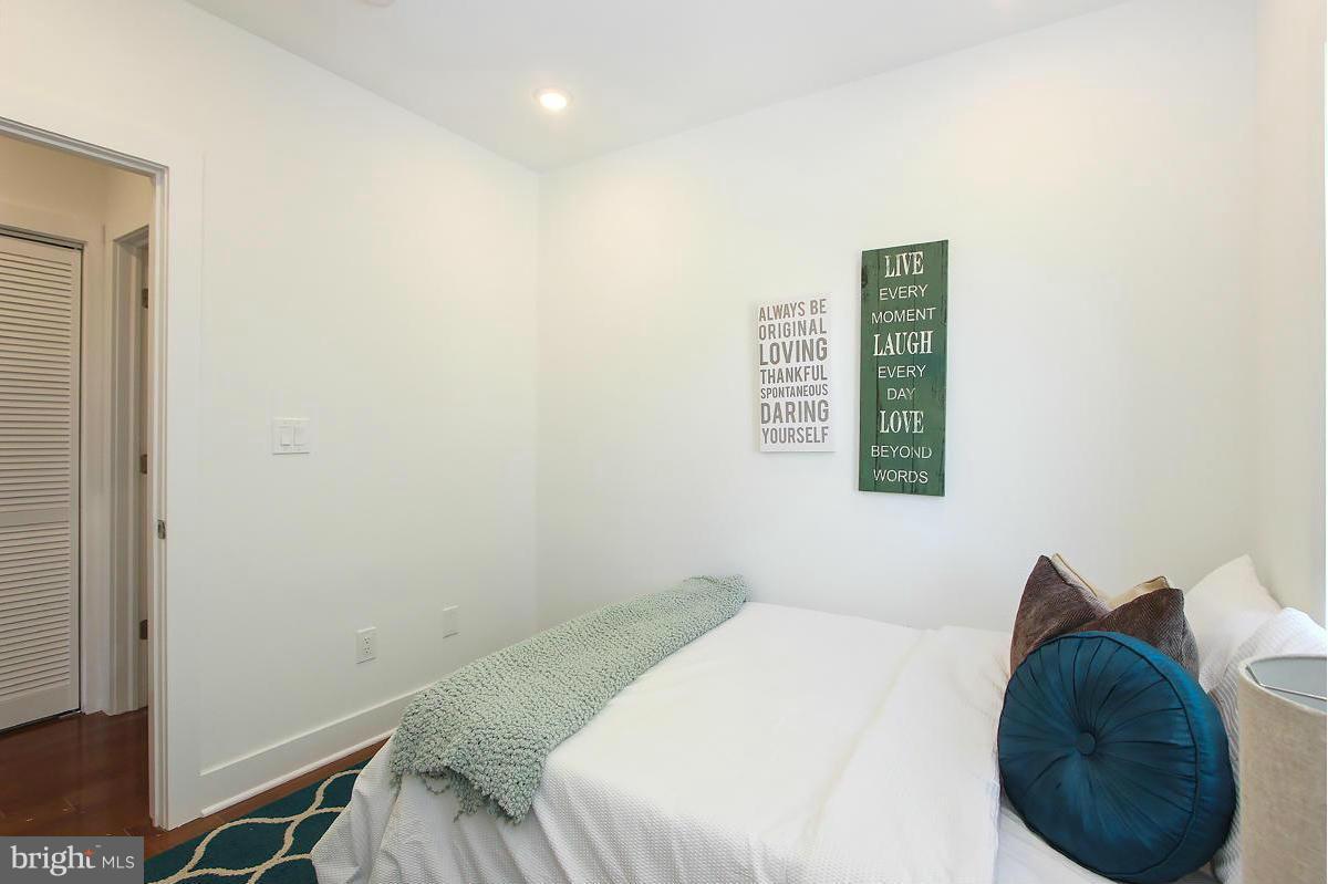 222 20th Street Northeast, Unit 1 Washington, DC 20002 - Photo 16 of 22 a bedroom with a bed and a window