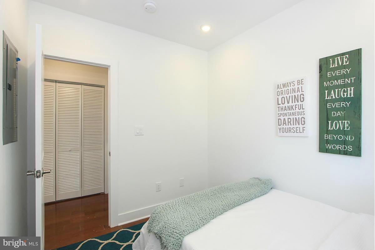 222 20th Street Northeast, Unit 1 Washington, DC 20002 - Photo 17 of 22 a bedroom with a bed and a window