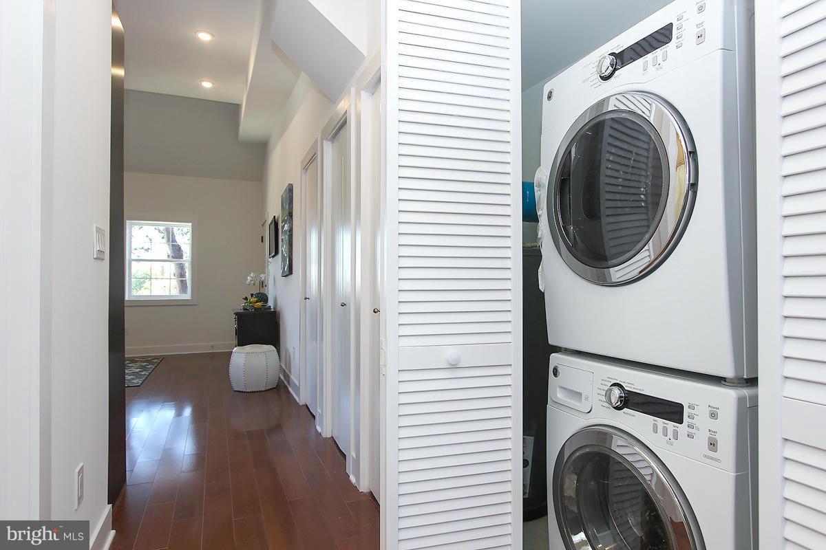 222 20th Street Northeast, Unit 1 Washington, DC 20002 - Photo 19 of 22 a view of a hallway with washer and dryer