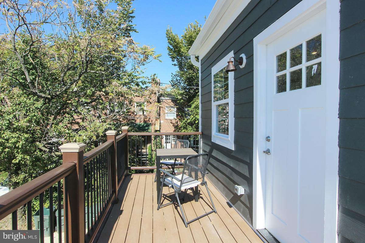 222 20th Street Northeast, Unit 1 Washington, DC 20002 - Photo 20 of 22 a balcony with wooden floor and outdoor seating