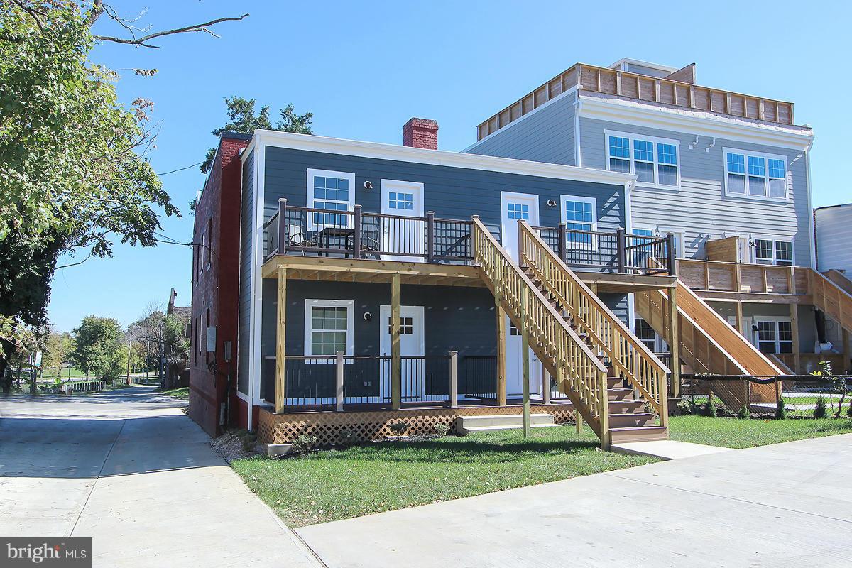 222 20th Street Northeast, Unit 1 Washington, DC 20002 - Photo 22 of 22 a front view of a house with a yard