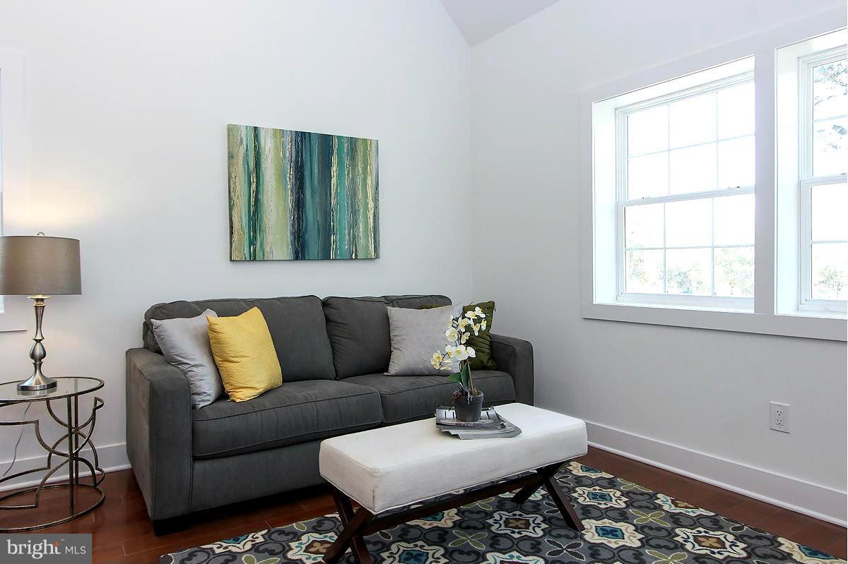 222 20th Street Northeast, Unit 1 Washington, DC 20002 - Photo 4 of 22 a living room with furniture and a window