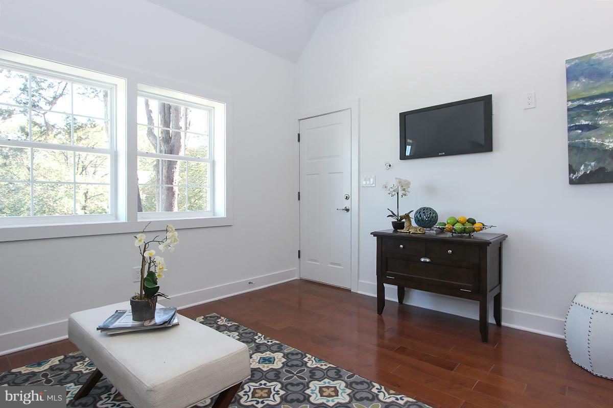 222 20th Street Northeast, Unit 1 Washington, DC 20002 - Photo 5 of 22 a living room with furniture and a flat screen tv