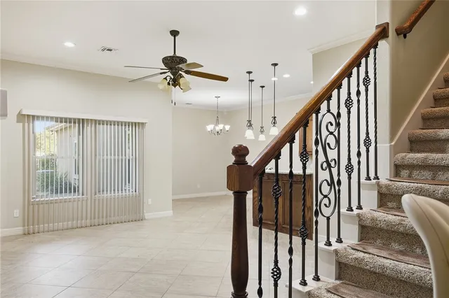 a view of a kitchen with kitchen appliances and a ceiling fan