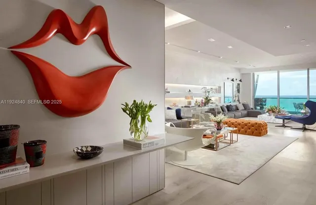 a kitchen with stainless steel appliances granite countertop a sink a stove and a wooden cabinets