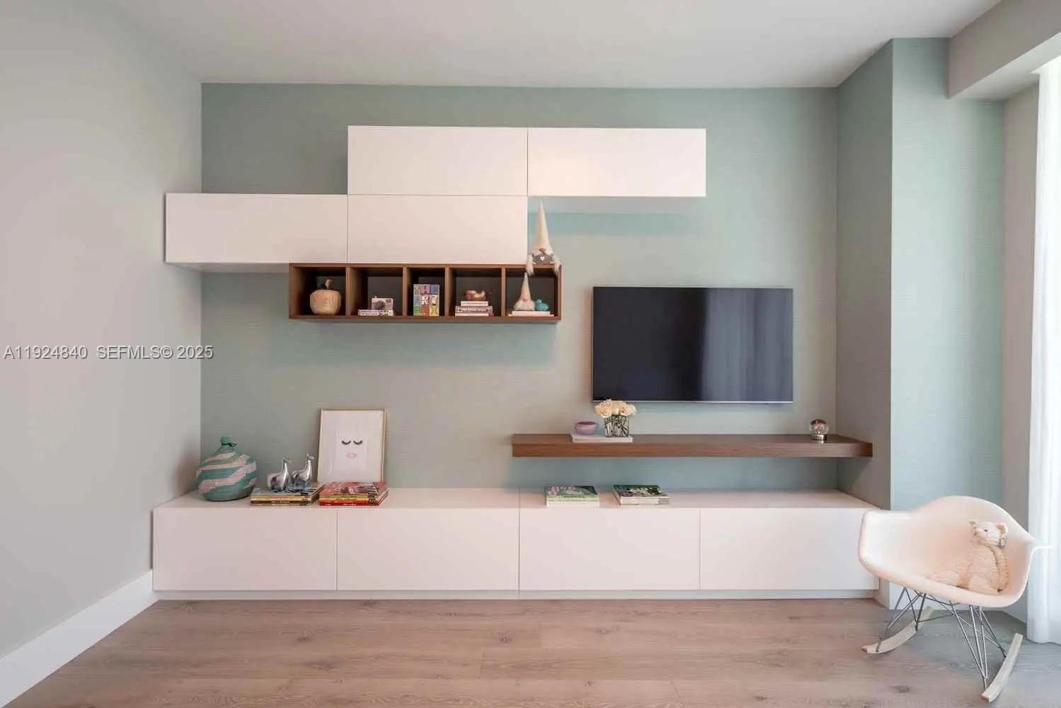 Surfside Surfside, FL 33154 - Photo 12 of 36 a living room with furniture and a flat screen tv