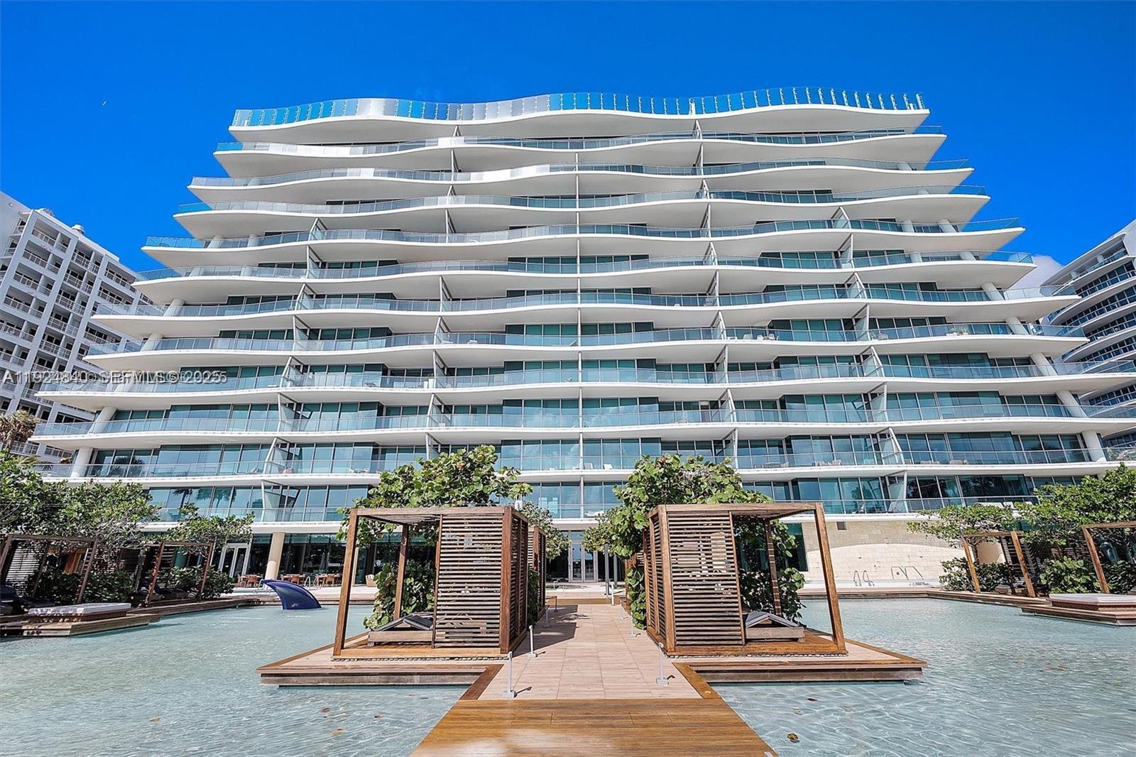 Surfside Surfside, FL 33154 - Photo 15 of 36 a view of tall building with outdoor seating