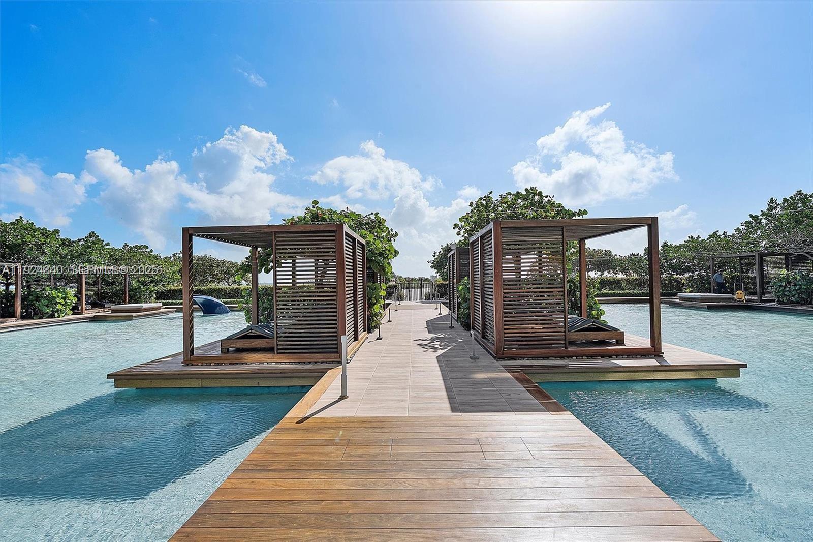 Surfside Surfside, FL 33154 - Photo 20 of 36 a view of a swimming pool with seating space