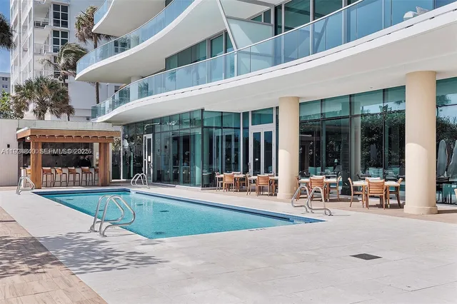 a living room with furniture a rug and a flat screen tv