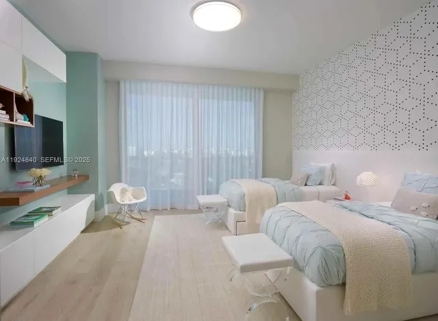 a bedroom with a bed and chair