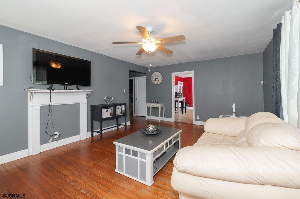 19 South 1st Road Hammonton, NJ 08037 - Photo 8 of 36 a living room with furniture and a flat screen tv