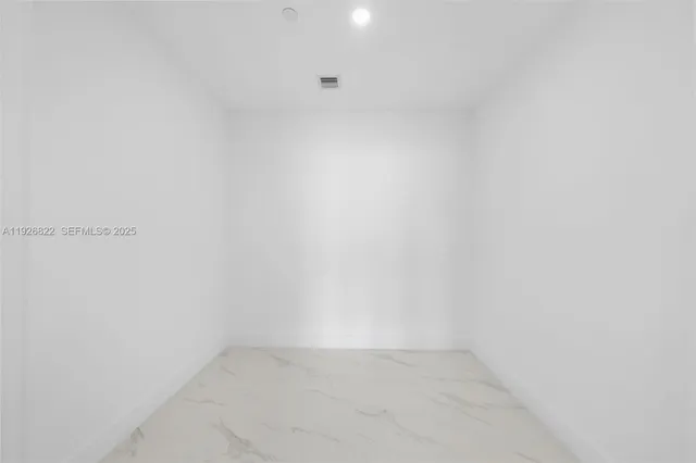 a bathroom with a toilet a sink and a mirror