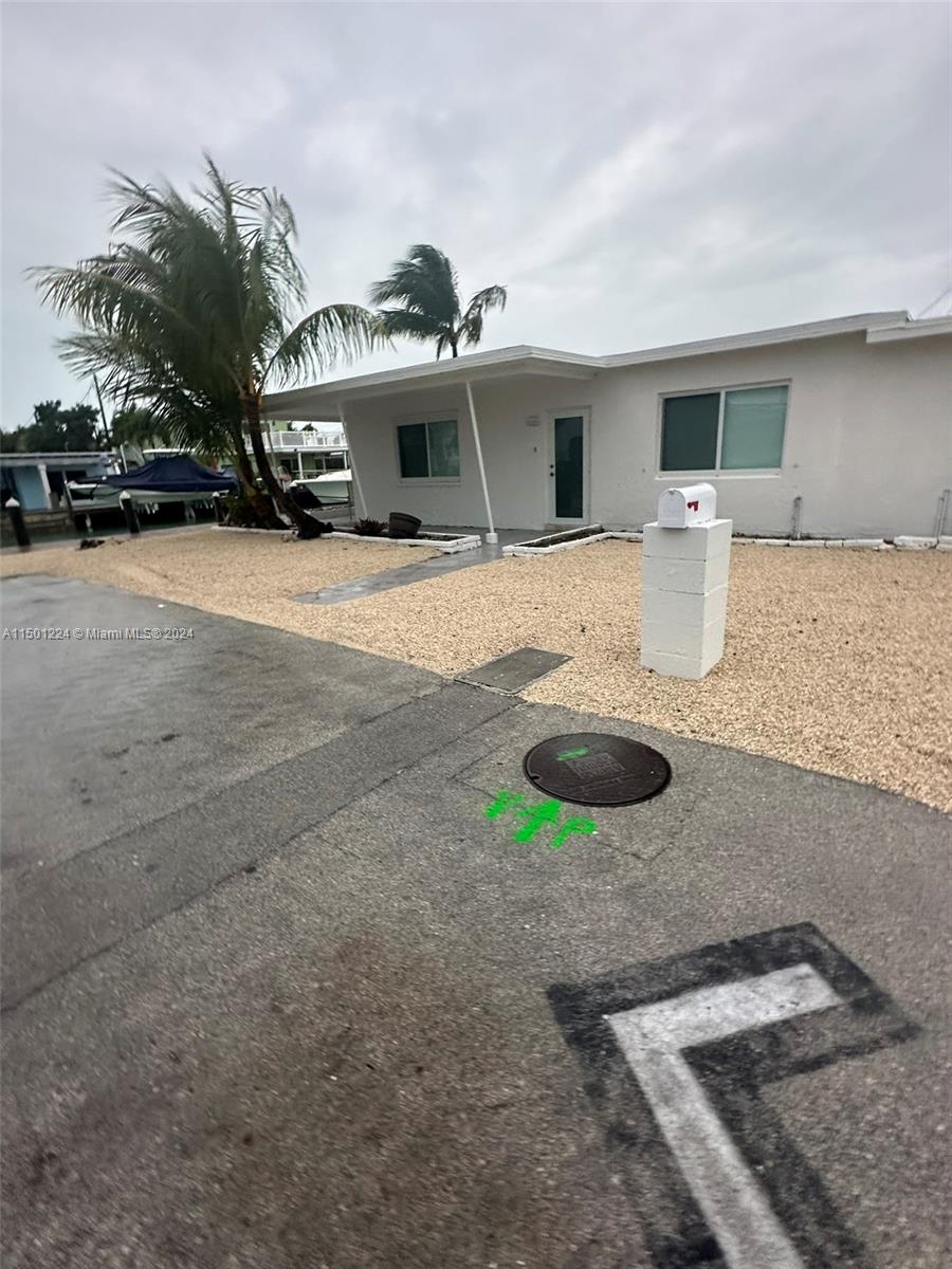 11326 5th Avenue Ocean Marathon, FL 33050 - Photo 2 of 27 a front view of a house with parking space