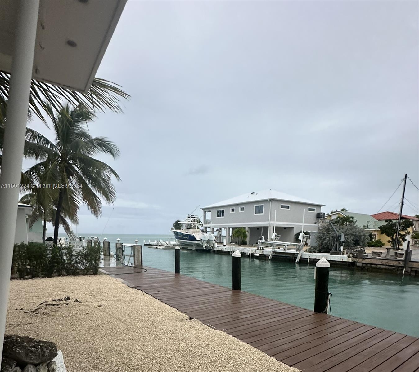 11326 5th Avenue Ocean Marathon, FL 33050 - Photo 27 of 27 a view of house with swimming pool and lake view