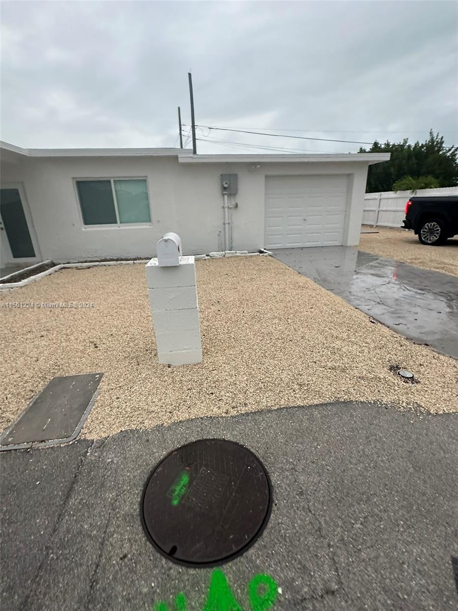 11326 5th Avenue Ocean Marathon, FL 33050 - Photo 4 of 27 a view of a kitchen with a sink and a fireplace