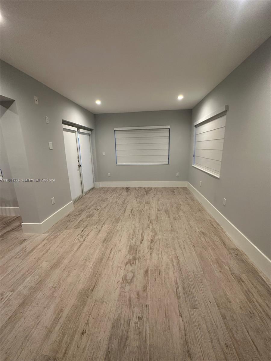11326 5th Avenue Ocean Marathon, FL 33050 - Photo 6 of 27 a view of empty room with wooden floor and fan