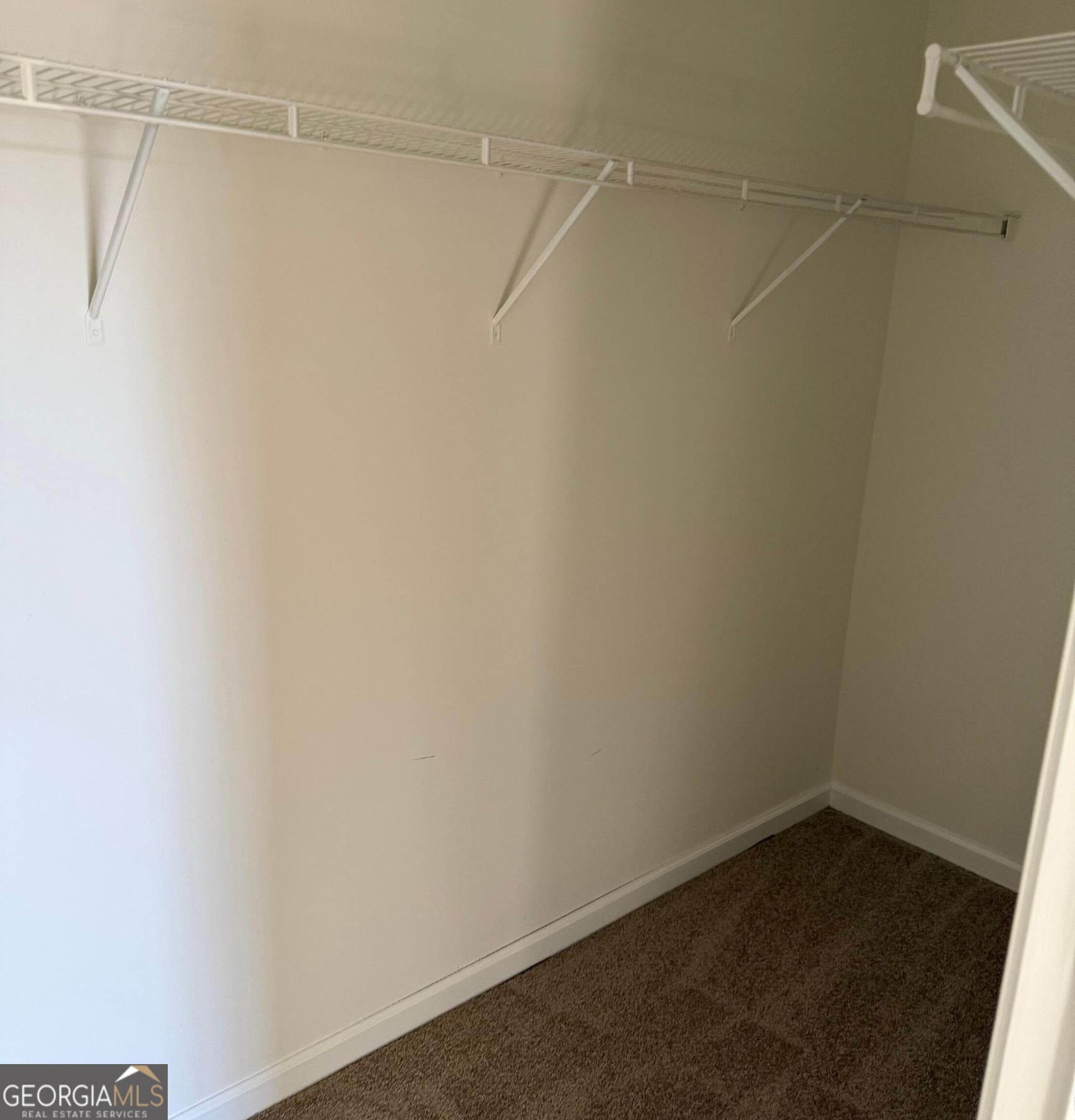 5471 Walnut Lane Lithonia, GA 30038 - Photo 19 of 40 a view of a room with racks on the wall